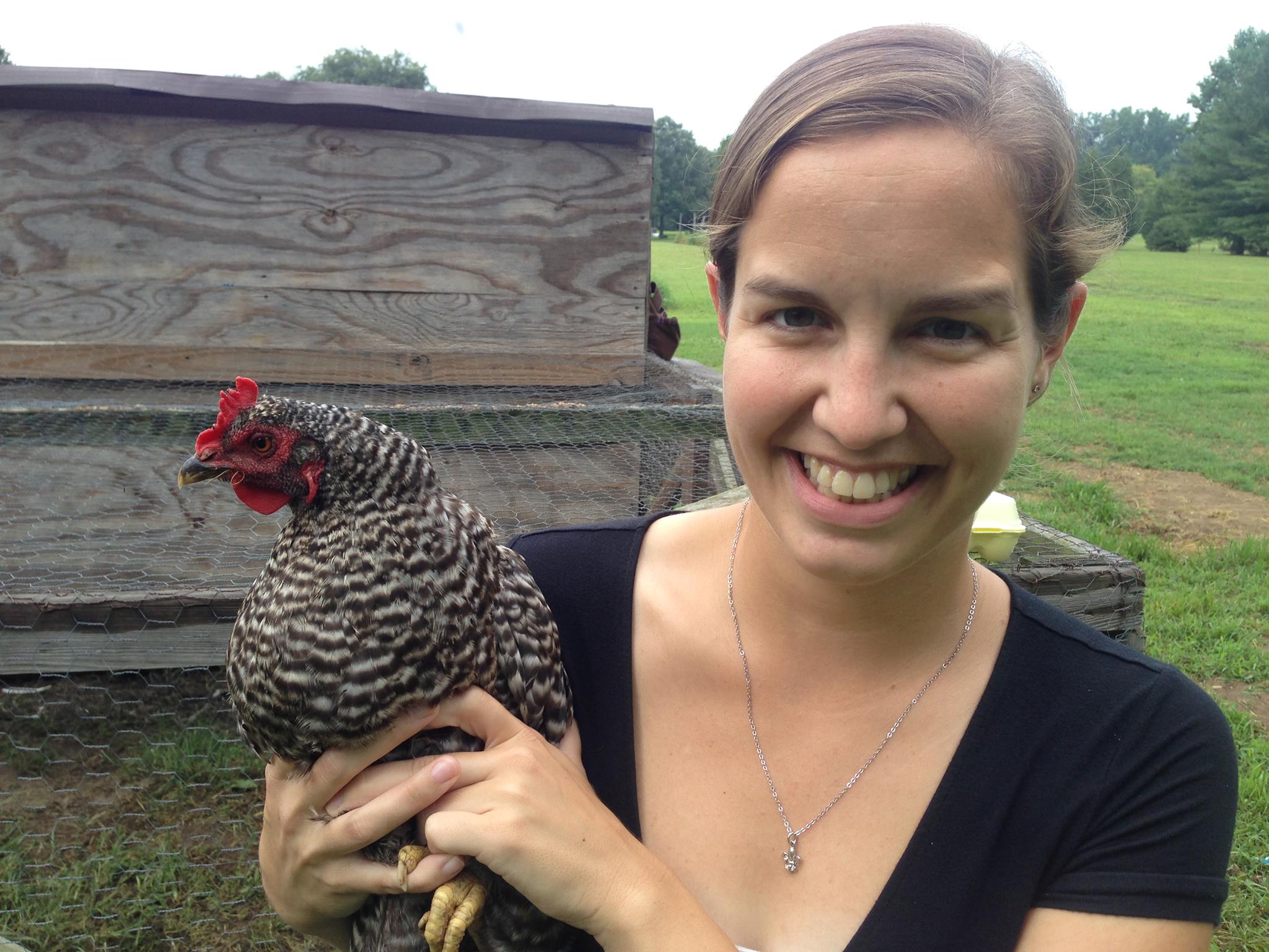 Colleen Earp holding a chicken.